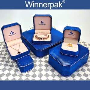 Winnerpak brand customized jewelry box manufacturer display showing various open blue boxes.