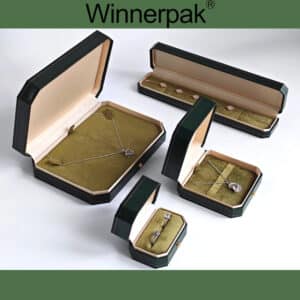 Open LE12 leatherette jewelry boxes showing a ring box, pendant box, bracelet box and necklace set box with velvet inserts.